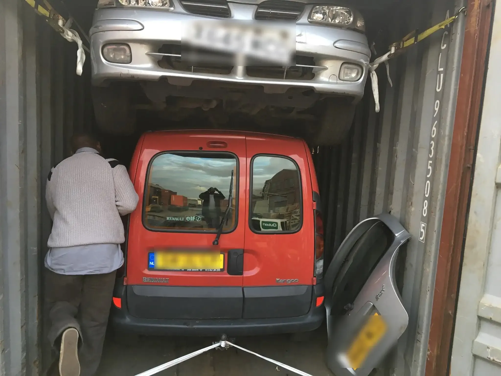 Cars and van loaded into a 20ft shipping container for export to West Africa