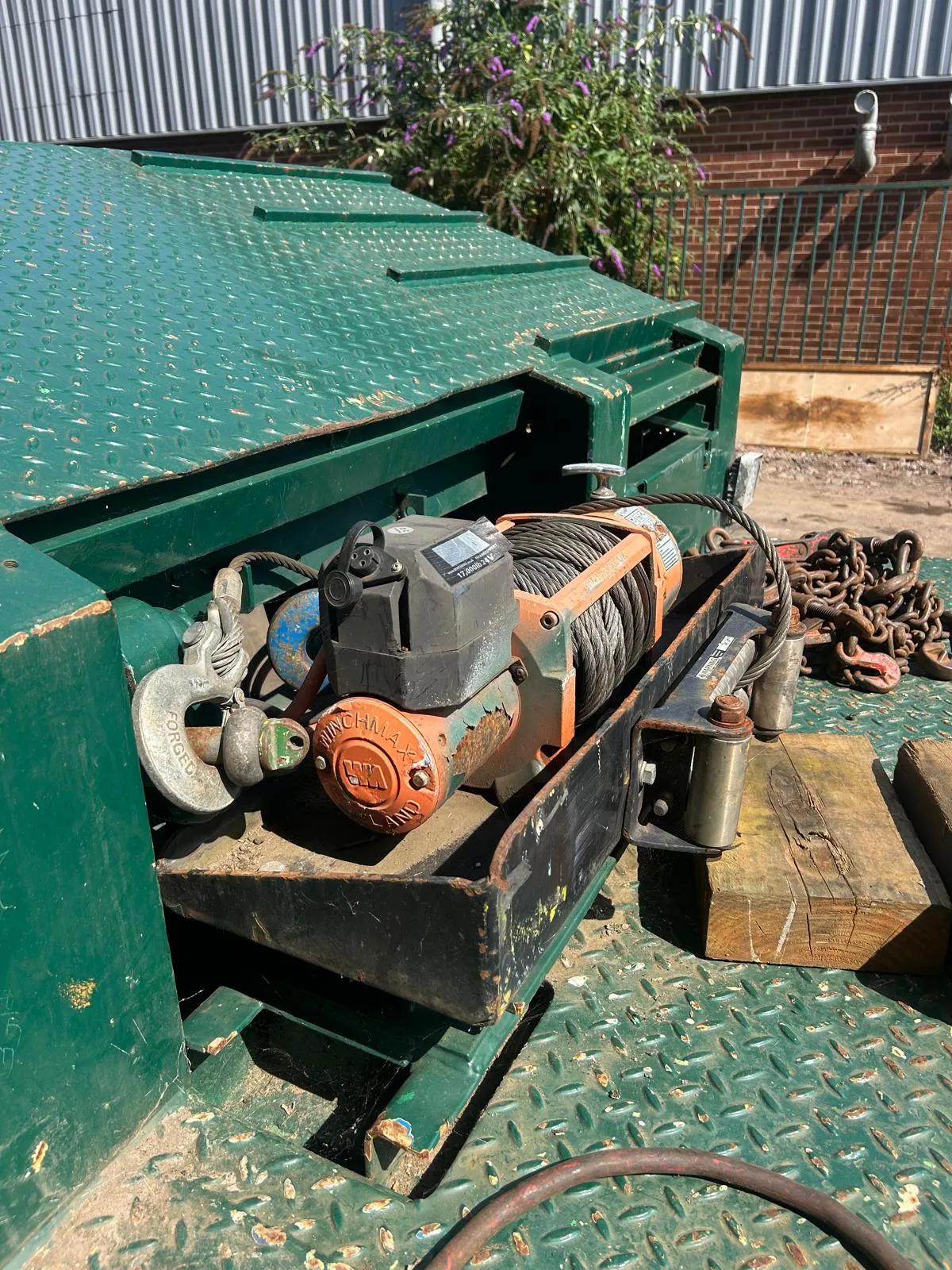 Rolats Services recovery trailer with WARN winch and chains used to load vehicles for sea freight to Africa from the UK